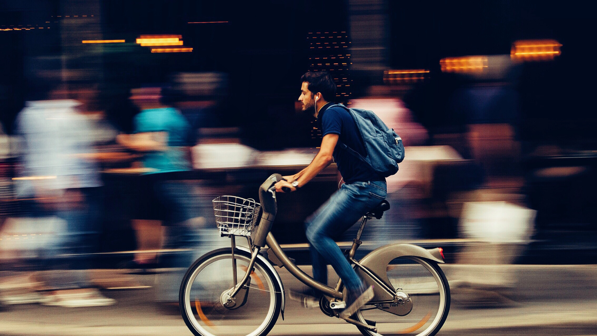 man-riding-bicycle-on-city-street