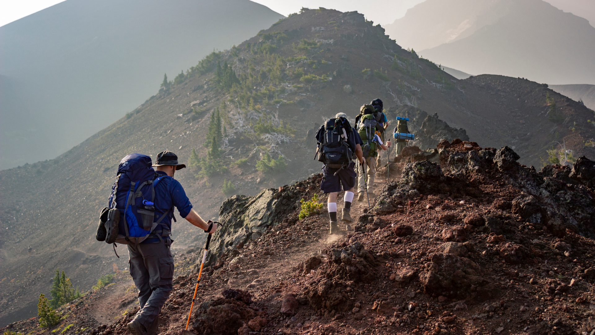 group-of-person-walking-in-mountain